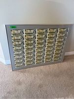 Full front view of framed uncut sheet leaning against wall