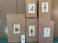 Five branded Patience Brewster boxes