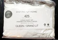 Photo of Distinctly Home sheet set packaging showing brand, thread count, cotton material, size, and quantity details.