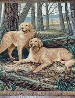 Close-up photo showing detailed depiction of two golden retrievers in forest setting on the throw, with visible signature in lower right corner.
