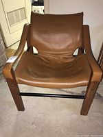 Front view of chair showing overall design, materials and finish