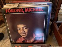 Front cover of 'Forever, Michael' LP showing young Michael Jackson portrait.