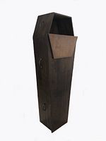 Front angle view of dark stained wooden coffin with the lid partially removed to show hollow interior.