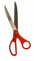 Photo of a single pair of giant novelty scissors with large metal blades and red plastic handles.