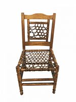 Side view of side chair showing rope webbing seat and back