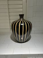Front view of the vase showing its shape and stripe pattern.