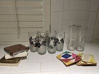 Full view of all glasses and coasters showing two sets of glasses and coaster stacks