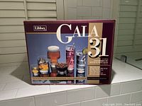 Original box of Libbey Gala 31-piece entertainment set shown with product image and descriptions.