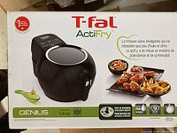 Front of box showing the T-fal ActiFry Genius air fryer image and key features including 1.2 kg capacity and low-oil cooking.