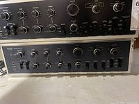 Front view showing control layout: bass, midrange, treble, volume, balance, mode selector and tape monitor switches