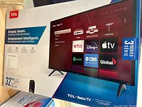 Front side of the sealed box displays the TCL Roku TV with interface visuals, model and key features.