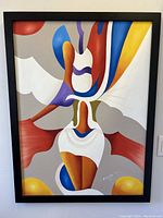 Front view of colorful abstract oil painting of stylized female figure with black frame, resting against a vehicle.