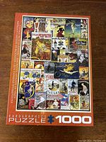Photo of the puzzle box front showing the completed vintage bicycle posters collage artwork and puzzle details.