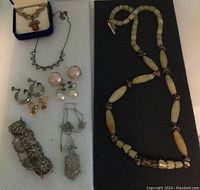 Group image showing the entire lot including various necklaces, earrings, and a bracelet.