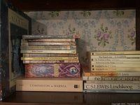 Image showing stack of C.S. Lewis books including Narnia series, The Cosmic Trilogy, Surprised by Joy, Companion to Narnia