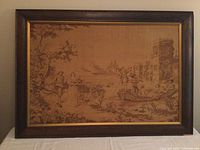 Full front view of the large framed tapestry showing entire textile artwork within the wood frame.