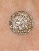 Obverse side of the 1904 Indian Head Penny showing Lady Liberty wearing a Native American headdress and the date 1904.