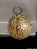 Front side of bronze 1914-1919 Great War Service Medal showing Angel of War figure with wings spread.
