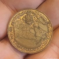 Close-up photo of the reverse side with a detailed map of Canada and inscription including the date 1939.