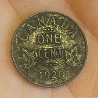 Reverse side of 1920 Canadian one cent coin showing the denomination and year 'ONE CENT 1920' along with maple leaf design.