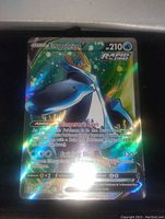 Clear holographic full art Pokémon card of Empoleon V with visible ability and attack text, Rapid Strike icon, and 210 HP in a foil finish.