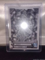 Front of Sonny Gray baseball card showing black and white image of player in pitching pose with number and card collector markings.