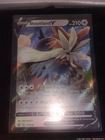 Close-up photo of the Stoutland V full art holographic foil Pokemon card showing all details and text.