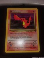 Close-up photo of the front of the 1999 Team Rocket's Charmander Pokemon card showing the card's artwork, HP, and text clearly.
