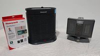 Honeywell air purifier, refill filter box and Patton space heater showing all items included in the lot.
