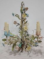 Side view showing detailed floral design and four candle-style bulbs with cream-colored sleeves