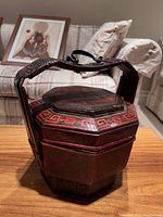 Front view of closed basket on wooden table