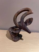 front view of polished stone kudu sculpture showing horns and face