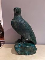 Front-view showing head and body detail and base