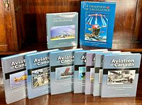 Full display of the books in the collection, showing nine 'Aviation in Canada' volumes and two other hardcover aviation books.