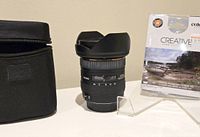 Lens, carrying case and boxed filter pack on display
