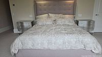 Assembled bed with headboard, side rails and footboard in room setting