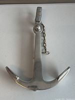 Photo showing front view of the stainless steel boat anchor with polished finish and pointed flukes.