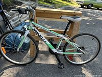 Side view of the complete Minelli bike showing frame design, wheels, seat, and handlebars.