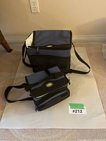 Two cooler bags, one large and one compact, arranged on white paper with lot number tag visible.