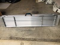 Ramp folded closed, showing full length and carry handle on top