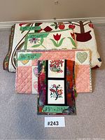 Overview of four quilts stacked, showing size labels for each