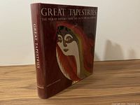 Front cover and side spine of 'Great Tapestries' reference book featuring stylized tapestry artwork with maroon background.