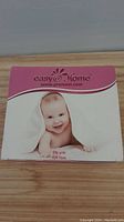 Front view of the Easy @ Home test kit box with baby image and branding.