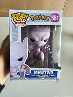 Front view of the Funko POP! box showing Mewtwo figure and front packaging.