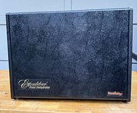 Front view of the dehydrator showing black textured surface and Excalibur branding.