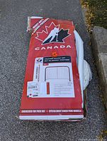Box of the heavy duty pro-form hockey net with Canadian hockey player silhouette, front view