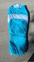 Full view of blue and gray sleeping bag laid flat, showing length and general style.