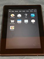 Front of Amazon Fire Tablet powered on showing home screen with apps