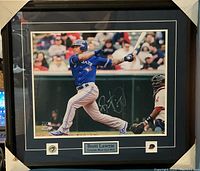 Framed signed photo of Brett Lawrie batting, clearly showing frame and nameplate details