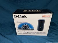 Front of the box showing the D-Link branding, product name, and image of the router device.